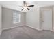 Bright bedroom featuring ceiling fan and neutral decor at 7227 Sweet Alyssum Ct, Tampa, FL 33619