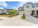Two-story townhouse with a two-car garage and palm trees at 7227 Sweet Alyssum Ct, Tampa, FL 33619