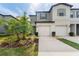 Two-story house with attached garage and landscaping at 7227 Sweet Alyssum Ct, Tampa, FL 33619