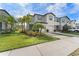 Two-story townhouse with two-car garage and lush landscaping at 7227 Sweet Alyssum Ct, Tampa, FL 33619