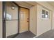 Welcoming front door with secure entry and bright exterior lighting enhances this home's curb appeal at 90 S Highland Ave # 1306, Tarpon Springs, FL 34689