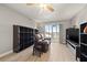 The living room has wood flooring and large sliding glass doors to the lanai at 90 S Highland Ave # 1306, Tarpon Springs, FL 34689