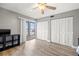 This bedroom offers dual closets and lanai access via sliding glass doors at 90 S Highland Ave # 1306, Tarpon Springs, FL 34689