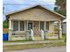 Tan Bungalow with front porch and small yard at 2005 N 25Th St, Tampa, FL 33605