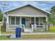 Tan Bungalow with front porch, and small yard at 2005 N 25Th St, Tampa, FL 33605