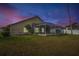 Serene backyard with pool at sunset at 10025 Cypress Shadow Ave, Tampa, FL 33647