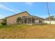 Large backyard featuring a screened pool at 10025 Cypress Shadow Ave, Tampa, FL 33647