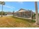 Spacious backyard with screened pool and patio at 10025 Cypress Shadow Ave, Tampa, FL 33647