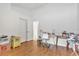 Bedroom with wood flooring, desk, and large closet at 10025 Cypress Shadow Ave, Tampa, FL 33647