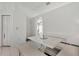 White breakfast nook with built-in bench seating and table at 10025 Cypress Shadow Ave, Tampa, FL 33647