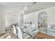 Open concept dining room with glass table and view of kitchen at 10025 Cypress Shadow Ave, Tampa, FL 33647