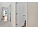 Bright hallway with doors to bedrooms and other rooms at 10025 Cypress Shadow Ave, Tampa, FL 33647