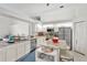 Modern kitchen with granite countertops and stainless steel appliances at 10025 Cypress Shadow Ave, Tampa, FL 33647