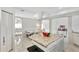 Open kitchen with granite island and view of breakfast nook at 10025 Cypress Shadow Ave, Tampa, FL 33647