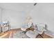 Serene living area with hardwood floors and white accent chairs at 10025 Cypress Shadow Ave, Tampa, FL 33647