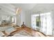 Open concept living room with hardwood floors and dining area at 10025 Cypress Shadow Ave, Tampa, FL 33647