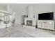 Living room with fireplace and kitchen bar at 10025 Cypress Shadow Ave, Tampa, FL 33647