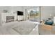 Living room with fireplace, pool view, and sliding glass doors at 10025 Cypress Shadow Ave, Tampa, FL 33647
