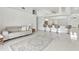 Open living room features a view into the kitchen and breakfast bar at 10025 Cypress Shadow Ave, Tampa, FL 33647