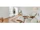 Relaxing living room with hardwood floors and white chairs at 10025 Cypress Shadow Ave, Tampa, FL 33647