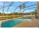 Relaxing screened pool overlooking tranquil water at 10025 Cypress Shadow Ave, Tampa, FL 33647