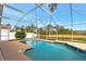 Beautiful screened pool with serene water views at 10025 Cypress Shadow Ave, Tampa, FL 33647