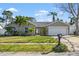Attractive single-story home with a two-car garage and well-manicured lawn at 10079 83Rd Way, Seminole, FL 33777