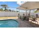 Enjoy this relaxing pool and patio area with a fire pit at 10079 83Rd Way, Seminole, FL 33777