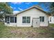 Private backyard with storage shed and screened patio at 10504 Tapestry Dr, Port Richey, FL 34668