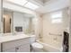 Bathroom with bathtub, toilet, vanity, and neutral colors at 10504 Tapestry Dr, Port Richey, FL 34668