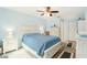 Main bedroom with white dresser and blue bedding at 10504 Tapestry Dr, Port Richey, FL 34668