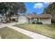 Charming ranch home with a spacious front yard and driveway at 10504 Tapestry Dr, Port Richey, FL 34668