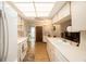 Modern kitchen with white cabinets and stainless steel appliances at 10504 Tapestry Dr, Port Richey, FL 34668