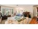 Living room with hardwood floors, bay window and comfortable seating at 10504 Tapestry Dr, Port Richey, FL 34668