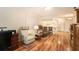 Spacious living room with hardwood floors and a view into the kitchen at 10504 Tapestry Dr, Port Richey, FL 34668