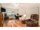Home office with recliner, desk, and wood flooring at 10504 Tapestry Dr, Port Richey, FL 34668