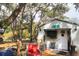 Charming backyard with a deck and shed at 11421 Petrel Ave, Weeki Wachee, FL 34614