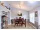 Bright dining room with a wood table and gray walls at 11421 Petrel Ave, Weeki Wachee, FL 34614