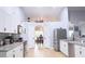 Modern kitchen with white cabinets, granite countertops and stainless steel appliances at 11421 Petrel Ave, Weeki Wachee, FL 34614
