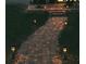 Brick pathway with solar lights leading to the house at 11421 Petrel Ave, Weeki Wachee, FL 34614