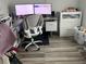 Home office features a corner desk, two monitors, and ample storage at 1202 W Camellia Dr, Brandon, FL 33510
