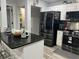 Modern kitchen with stainless steel appliances and breakfast bar at 1202 W Camellia Dr, Brandon, FL 33510