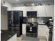 Updated kitchen with stainless steel appliances and granite counters at 1202 W Camellia Dr, Brandon, FL 33510