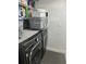 Laundry room with LG washer and dryer and overhead storage at 1202 W Camellia Dr, Brandon, FL 33510