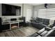 Relaxing living room featuring a large TV, fireplace, and comfortable seating at 1202 W Camellia Dr, Brandon, FL 33510
