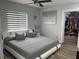 Main bedroom with large bed, walk-in closet, and window blinds at 1202 W Camellia Dr, Brandon, FL 33510