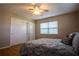 Bedroom with wood floors, a ceiling fan, and ample closet space at 1309 Nokomis S Ave, Venice, FL 34285