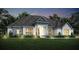 Stunning one-story home with stone accents and a landscaped lawn at 13510 Haflinger Way, Hudson, FL 34667