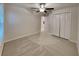 Bedroom with ceiling fan and double door closet at 14428 English Lavender Dr, Wimauma, FL 33598