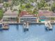 Waterfront property with solar panels, pool, and private dock with boats at 1818 Dolphin S Blvd, St Petersburg, FL 33707